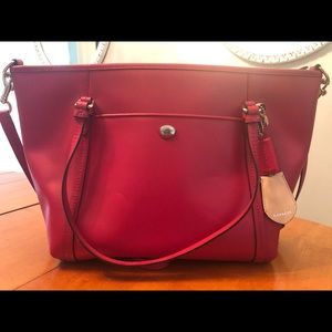 Bright pink Coach purse